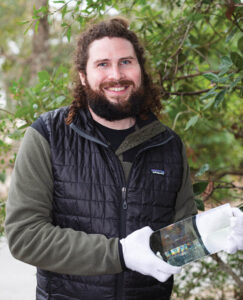 Jake Grossman holds one of the prisms for the Cape Fear Lighthouse's lens