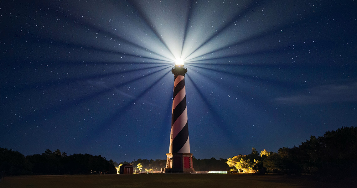 The Cape Hatteras Lighthouse shines bright at night