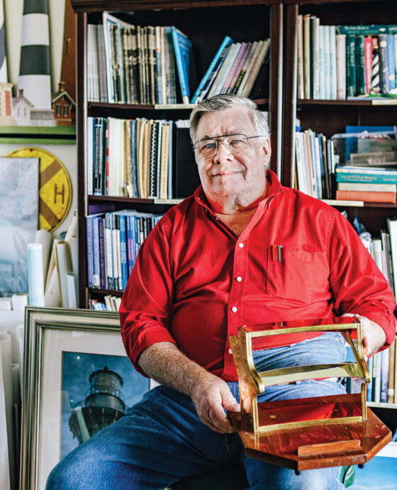 John Havel with books, documents and replicas associated with the Hatteras Lighthouse