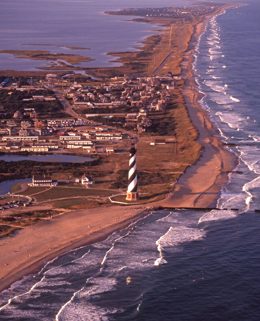 Hatteras Island in the 1990s, when the Hatteras Lighthouse stood on the beach itself before it was moved to its current location.