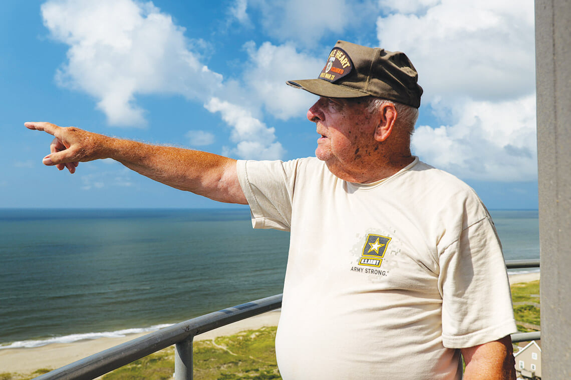 Chris Christensen at the top of the Oak Island Lighthouse