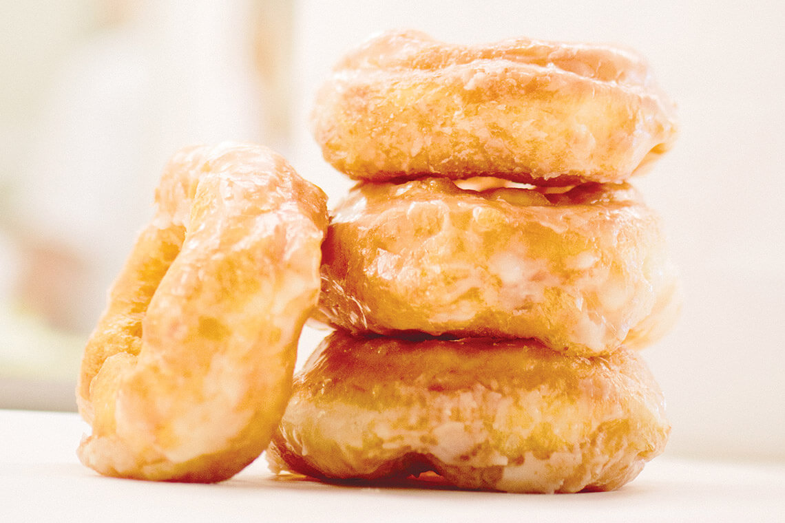 Stack of glazed doughnuts from Britt's Donuts Shop in Carolina Beach