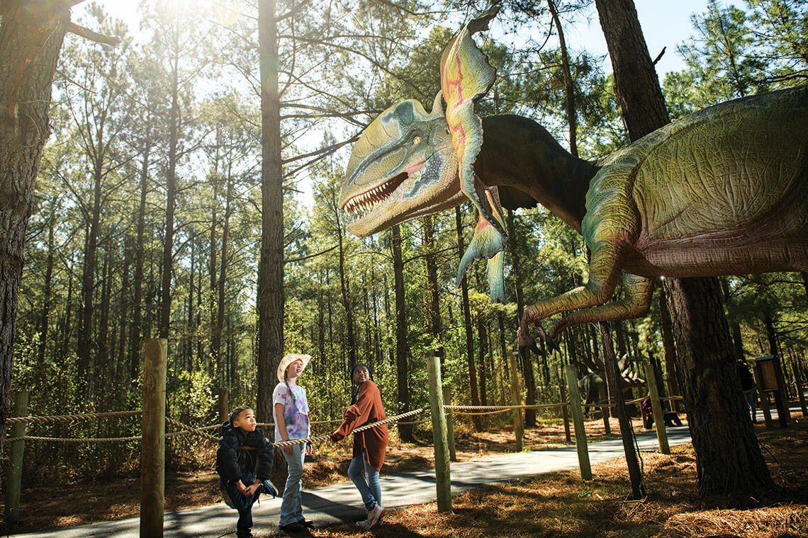 Children marvel at the animatronic dinosaurs at Sweet Valley Ranch