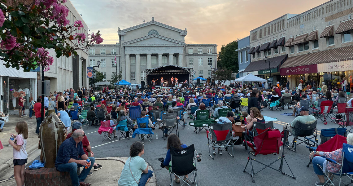 People gather for live music outside the courthouse in Downtown Lincolnton's