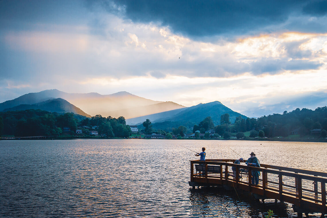 People fish off the pier at Lake Junaluska