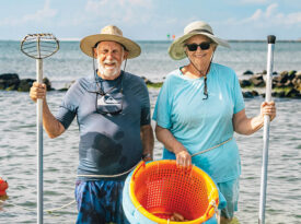Bob and Ruth Toth with their clam rakes in Pamlico Sound