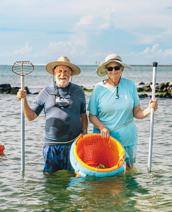 Bob and Ruth Toth with their clam rakes in Pamlico Sound