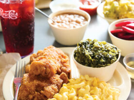 A spread from Southern Lunch in Lexington, including fried chicken, mac n cheese, collard greens, and a Pepsi