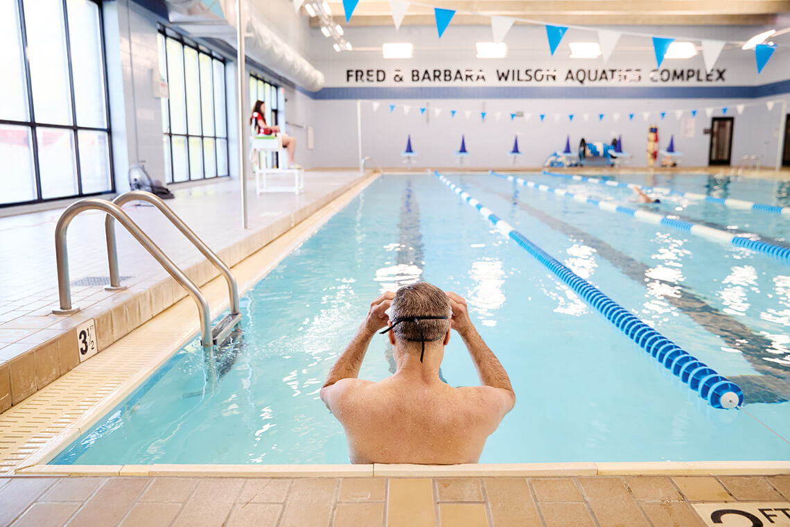The writer in the pool at the Hartley Drive Family YMCA