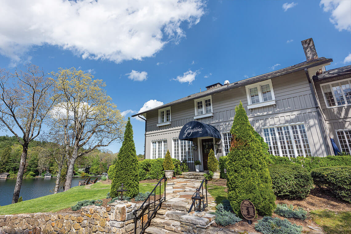 The entrance to The Greystone Inn with Lake Toxaway in the background