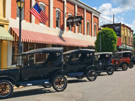 Model cars parked outside of shops in Plymouth, NC