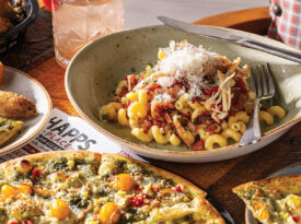 A strawberry-infused cocktail, chicken-bacon-ranch pasta, a Mountain of Veg pizza, and lemon pepper wings at Happs Place Barn and Grill.