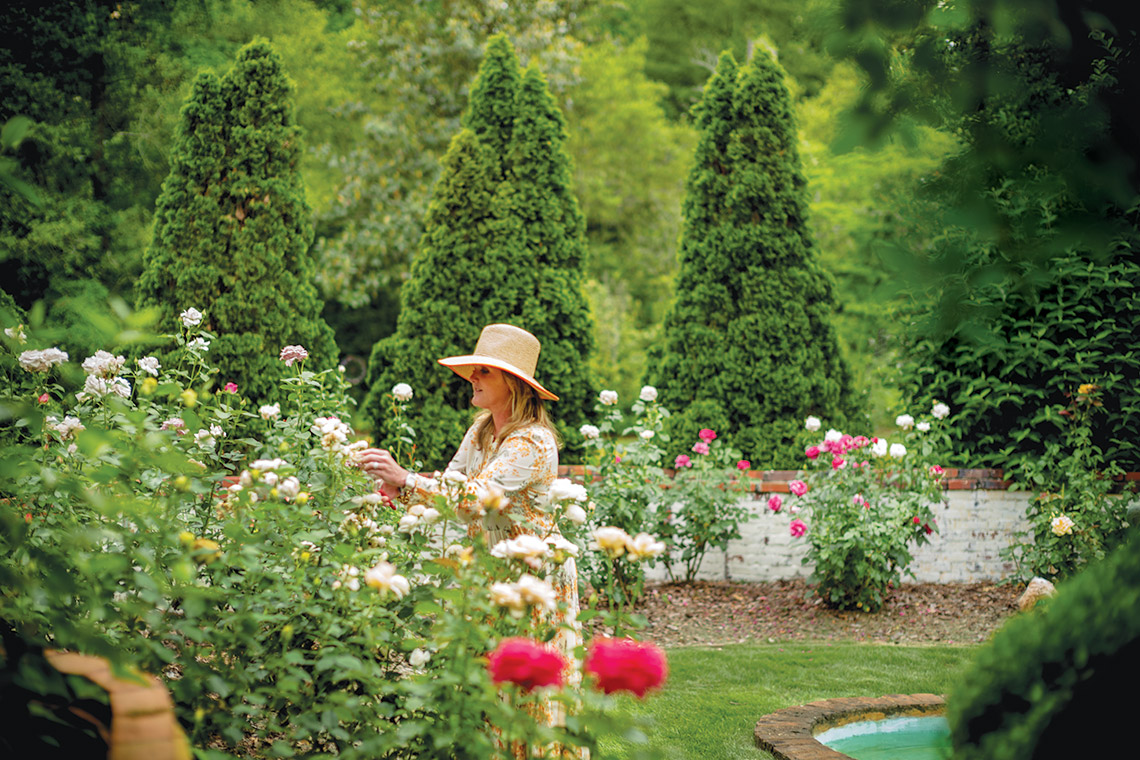 Elizabeth Woodard working in their garden