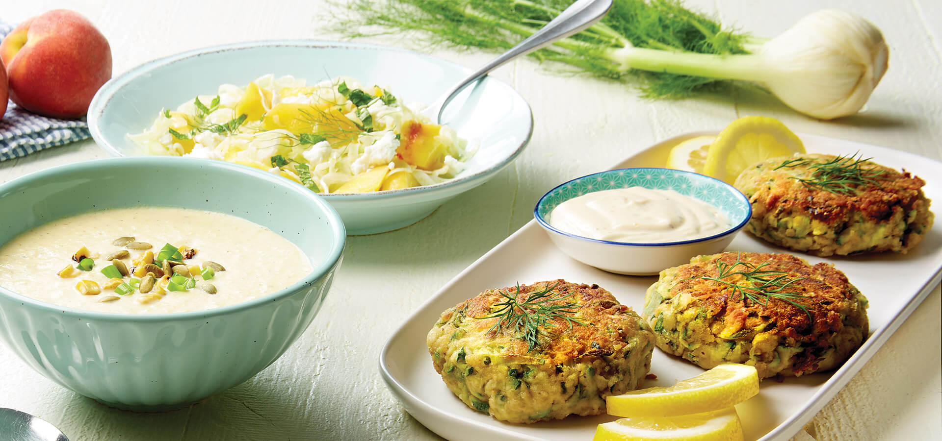 Summer recipes include corn soup, zucchini "crab" cakes, and peach salad.