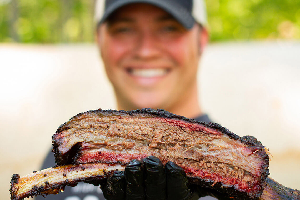 Pitmaster and restaurateur Christopher Prieto and a beef rib