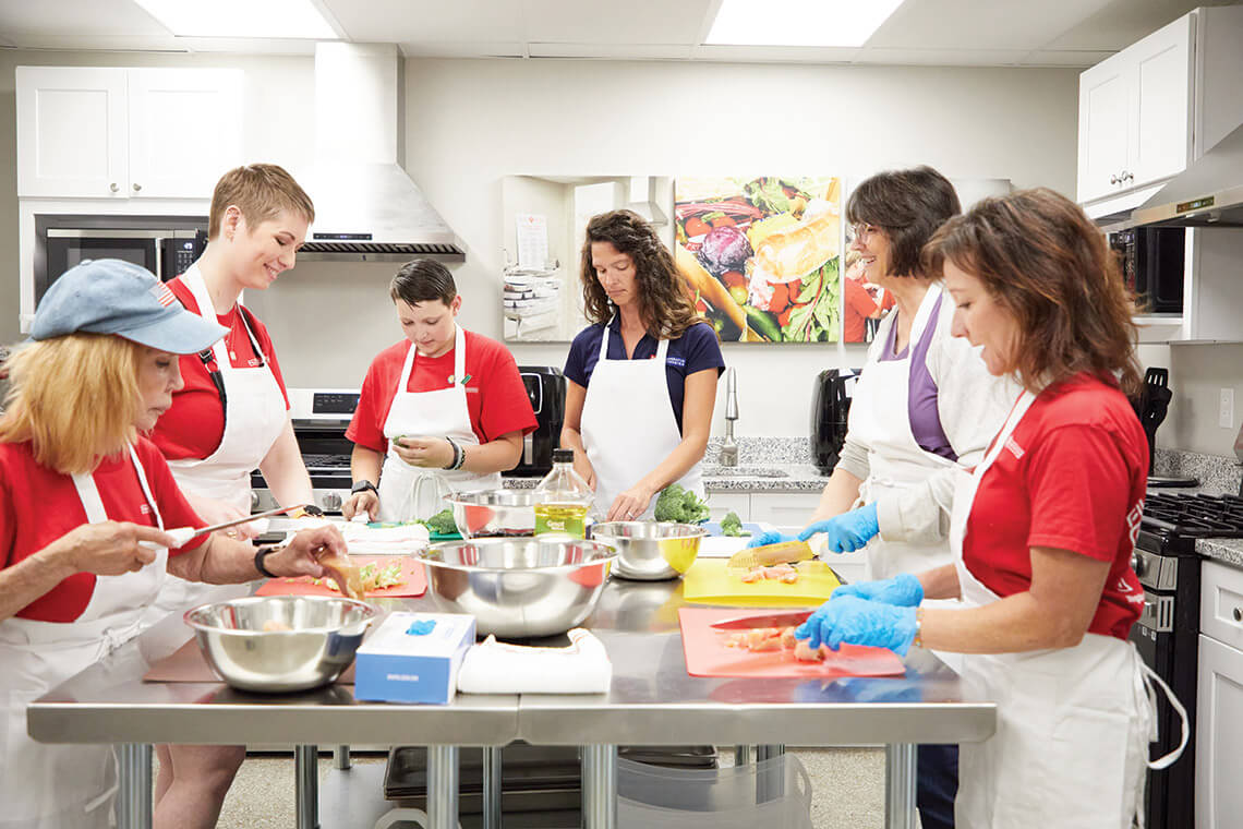 Volunteers cooking at The Filling Station