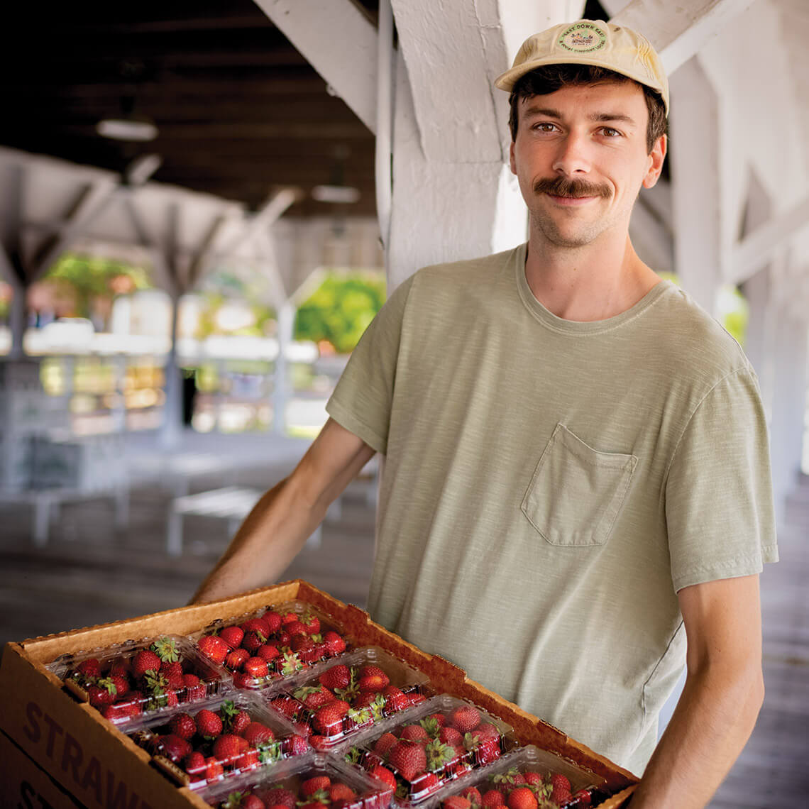 J.T. Crawford packs fresh strawberries for Feast Down East