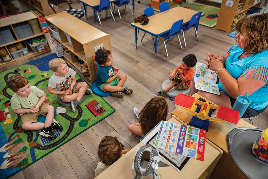 Franklinton United Methodist Church member Tracey Phillips teaches sign language to kids at the church's childcare center. 