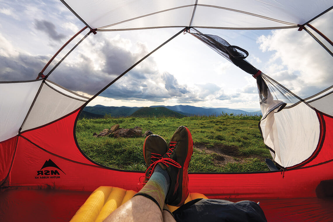 Hiker in a tent at Pisgah National Forest