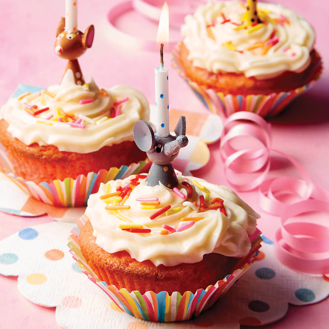 Strawberry cupcakes with birthday candles