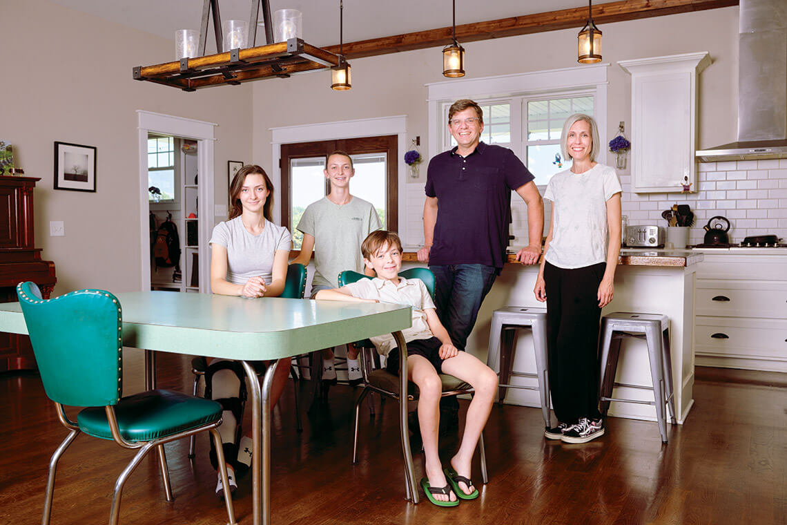 The author with his wife and three children in their home kitchen. 