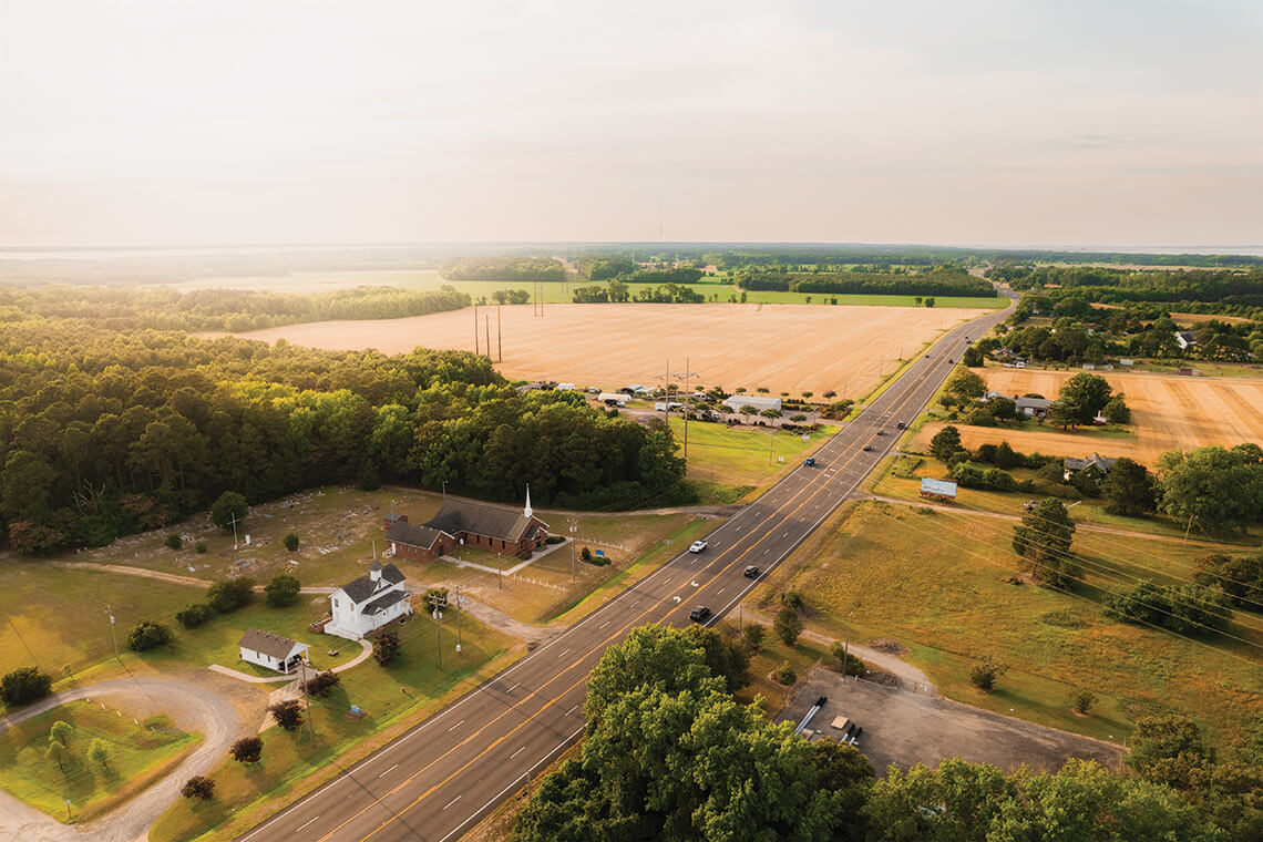 The Jarvisburg Colored School surrounded by fields in Currituck County