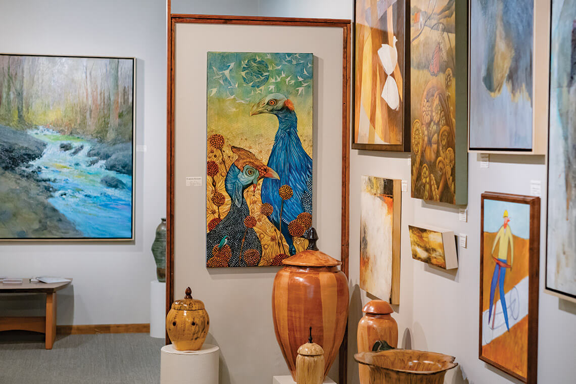 Paintings hang in the Carlton Gallery