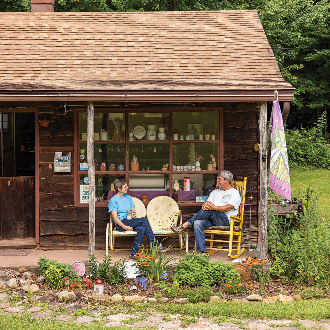 Pete and Kim McWhirter on the porch of their pottery studio
