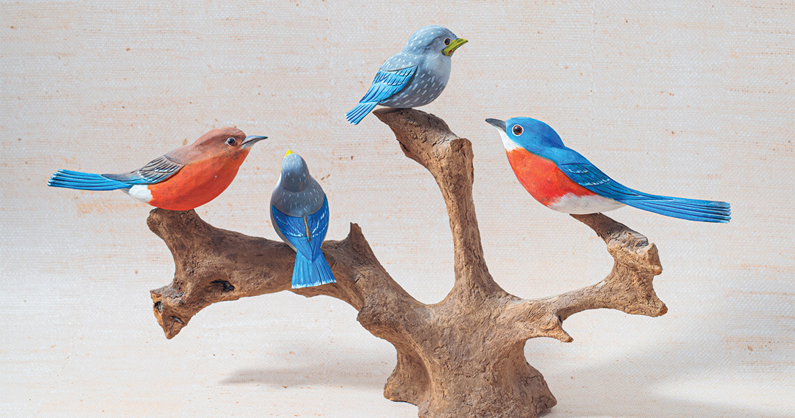Tony Dills uses his keen eye and love of the natural world to transform blocks of wood into a flock of beautiful bluebirds.
