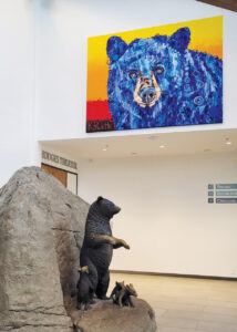 7½-by-10-foot canvas of a bear on display at the Wilson Center for Nature Discovery.