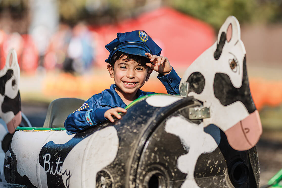Child aboard the cow train at Kersey Valley