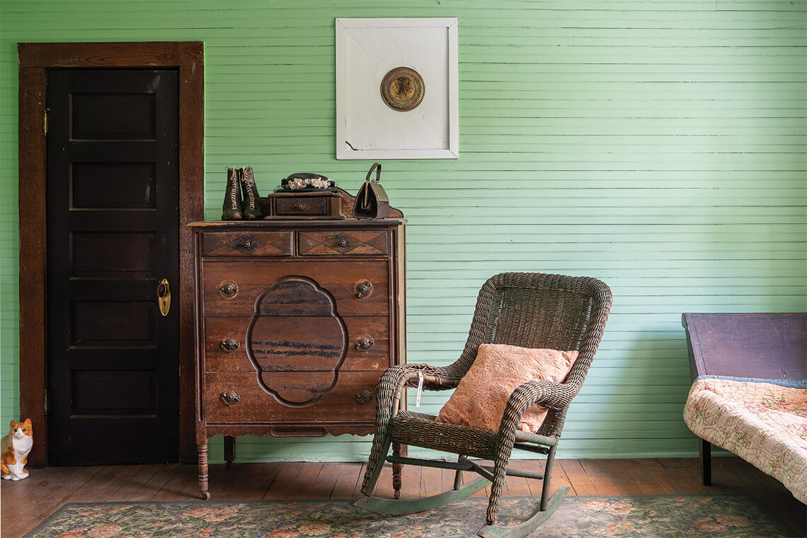 Edna and Edith Monteith’s accessories are displayed in their shared bedroom, where they likely spent mornings getting ready to work hard around their home and town.