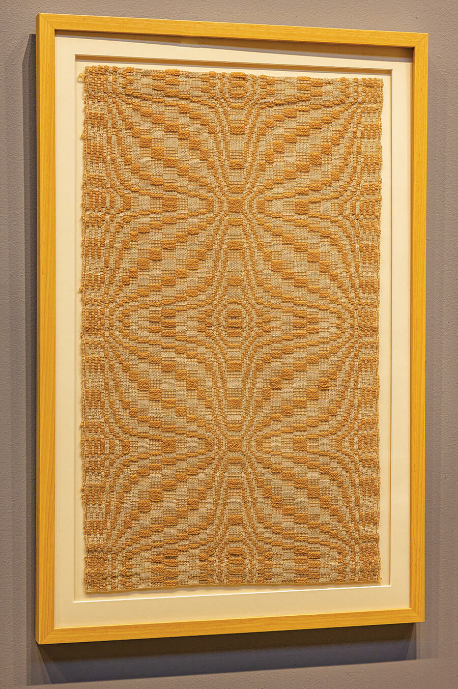 A reproduction of the coverlet hangs in the Folk Art Center.