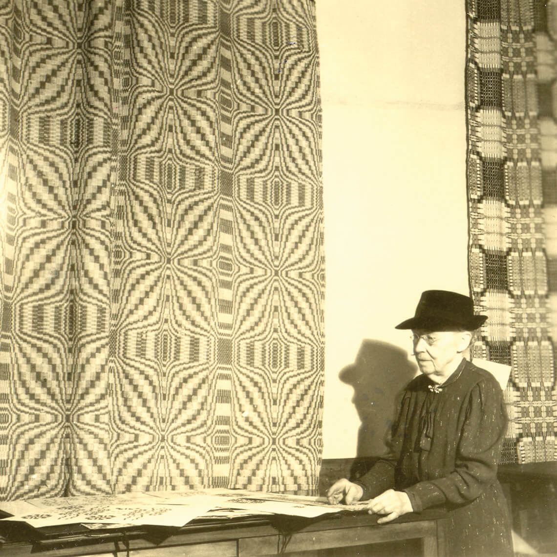 Frances Goodrich weaving the coverlet that launched the Southern Highland Craft Guild