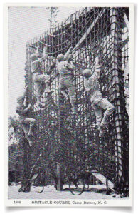 Children climbing up the base's cargo net at Camp Butner