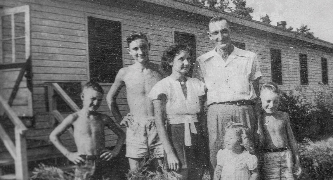 Black-and-white photo of Tom Lane and his family in Camp Butner