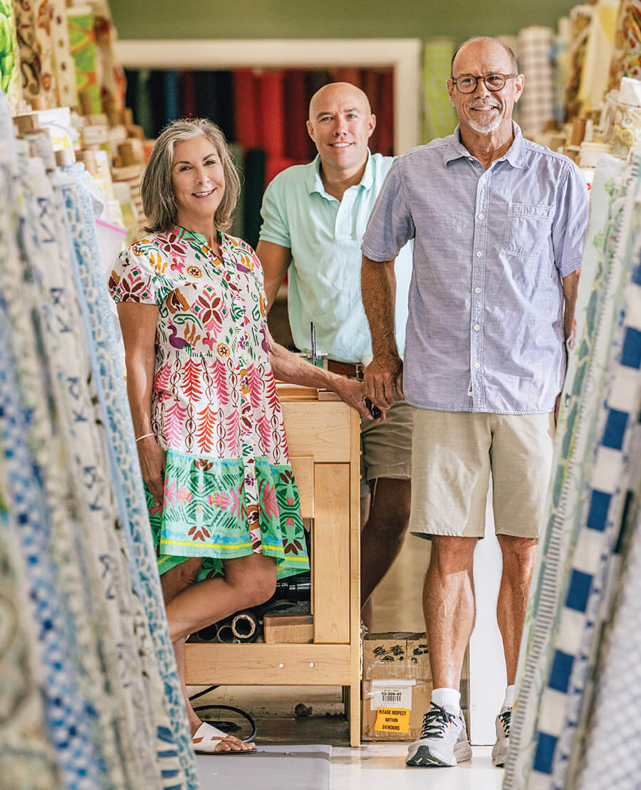 Elizabeth, John, and Johnny Bridgerses inside the Cloth Barn in Goldsboro