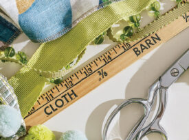 Measuring fabric and baubles at The Cloth Barn.