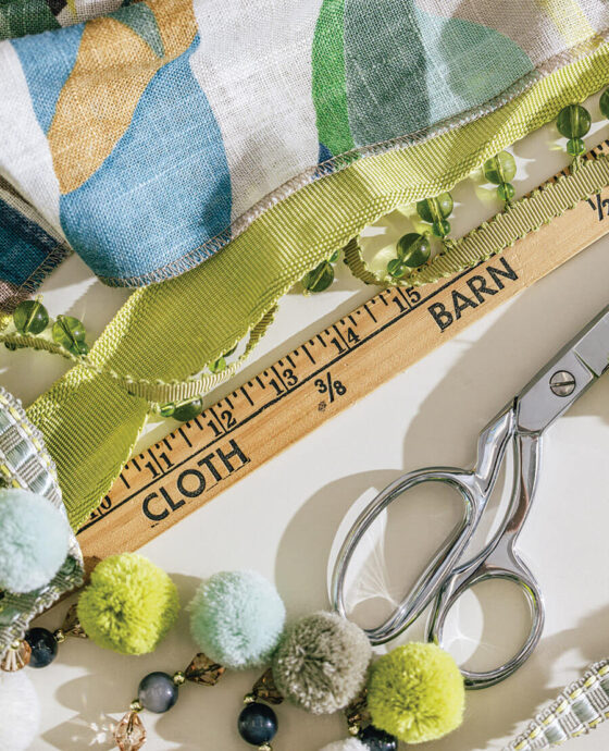 Measuring fabric and baubles at The Cloth Barn.