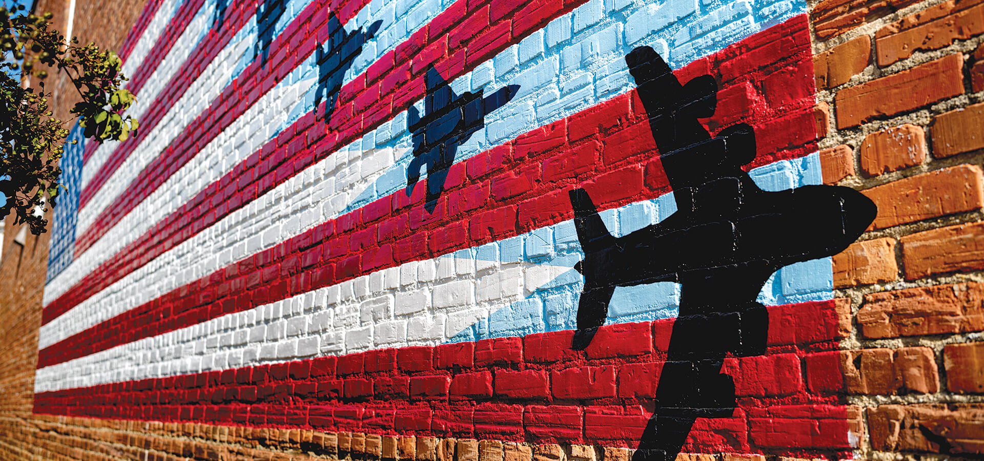 The Moving Forward mural on the side of Goldsboro Brew Works.