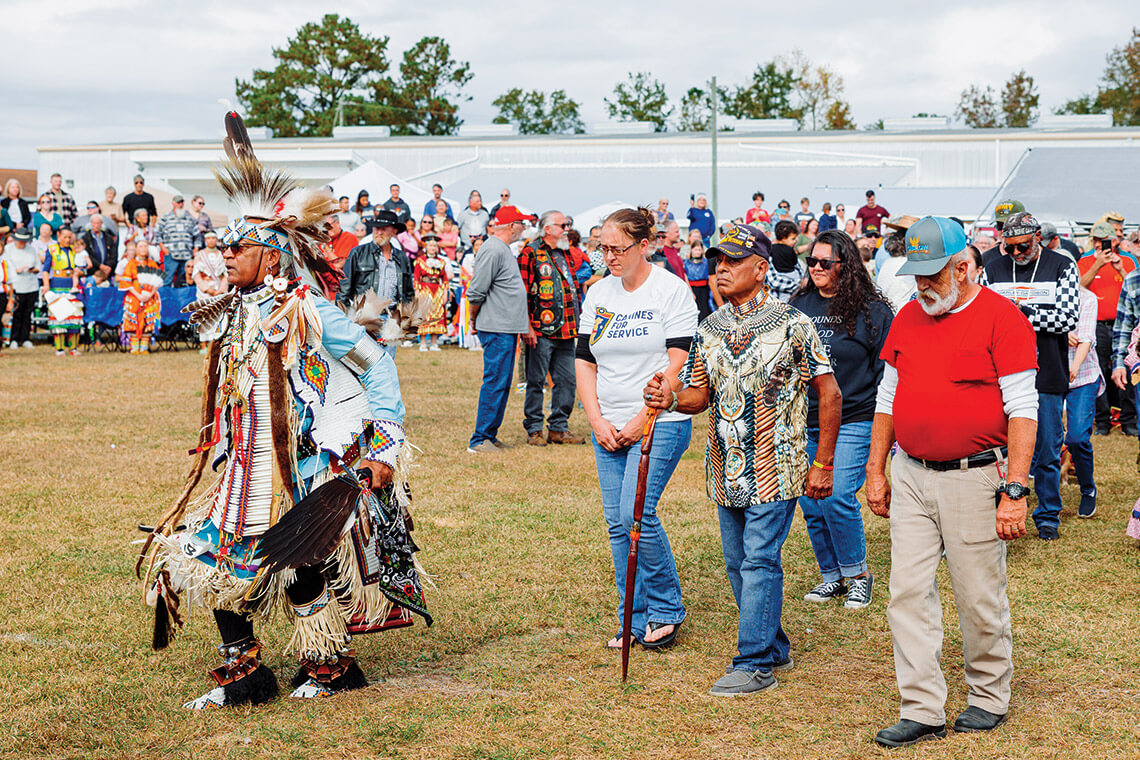 During the Veterans Honor Song, service members of all backgrounds — including Quintero (second from right) — enter the arena together for the Onslow Veterans Pow Wow