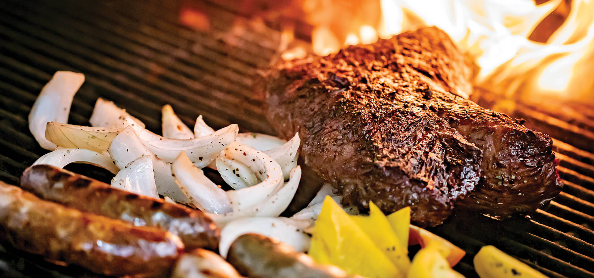 Cooking meat and vegetables on the grill at The Gamekeeper