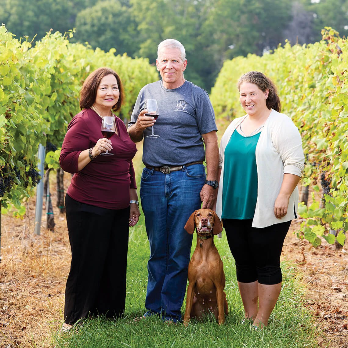 Becky and Deane Muhlenberg with their daughter, Ashley, at Haze Gray Vineyards