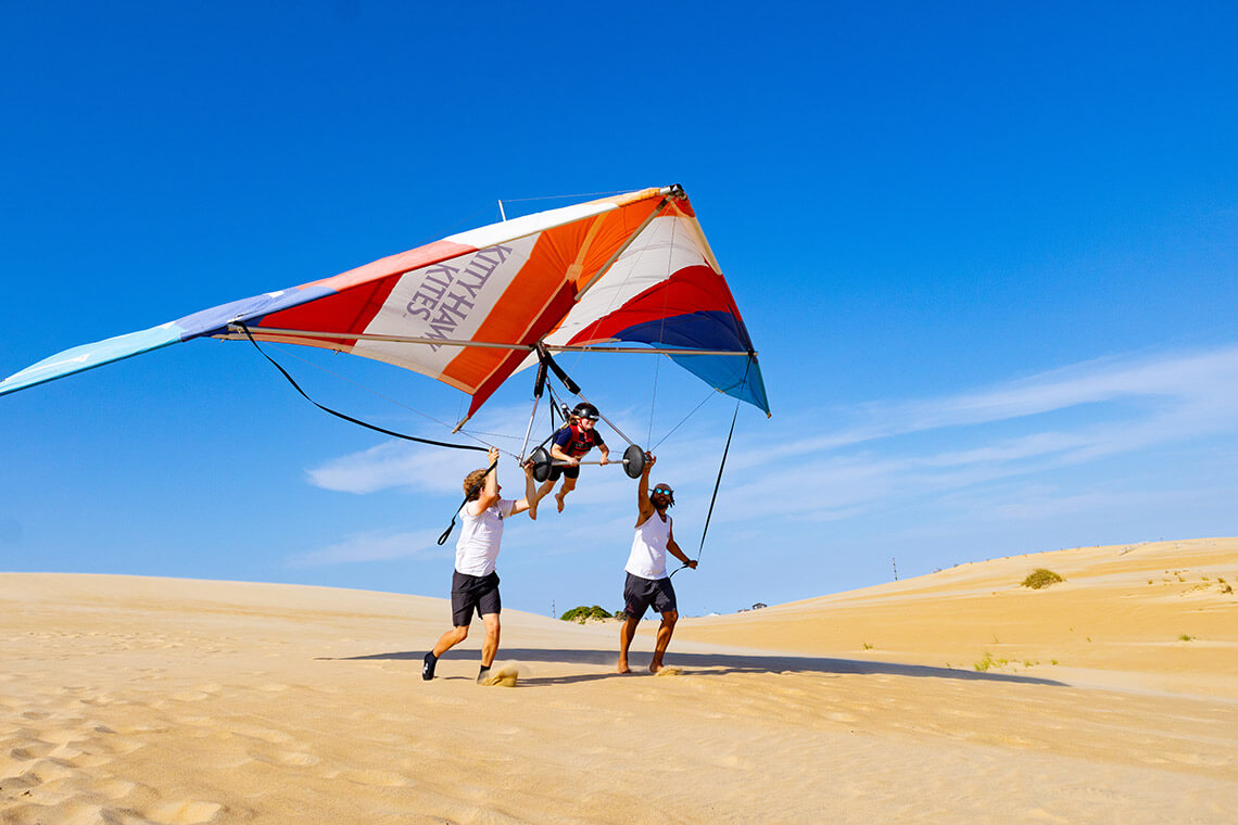 Hang-gliding instructors teach at Kitty Hawk Kites