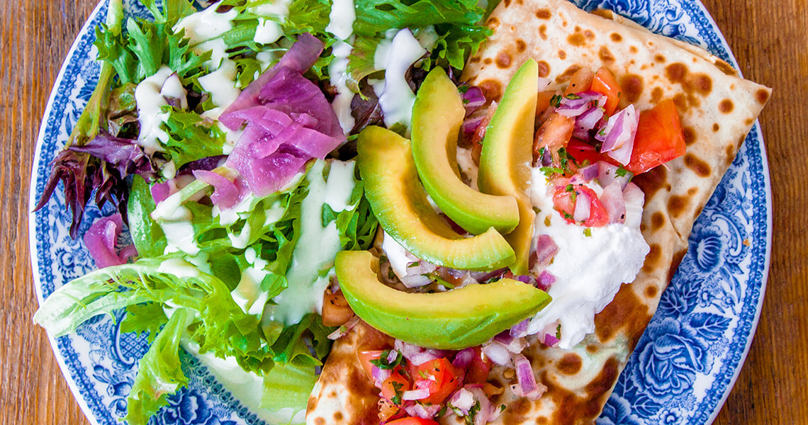 Plate with a savory crepe and salad from Betsy's Crepes in Southern Pines