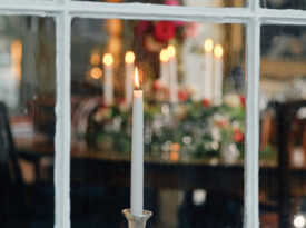 Candles in the window on Edenton's candlelight christmas tour