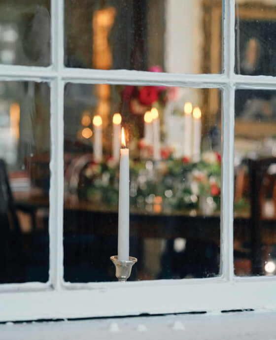 Candles in the window on Edenton's candlelight christmas tour