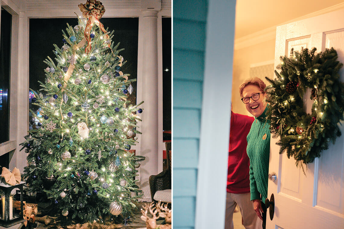 Christmas tree on front porch, homeowner opens front door on the Christmas Candlelight Tour in Edenton, NC