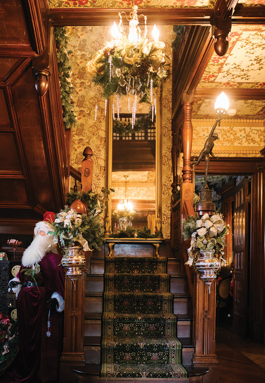 The main staircase inside Harper House, all decorated for Christmas