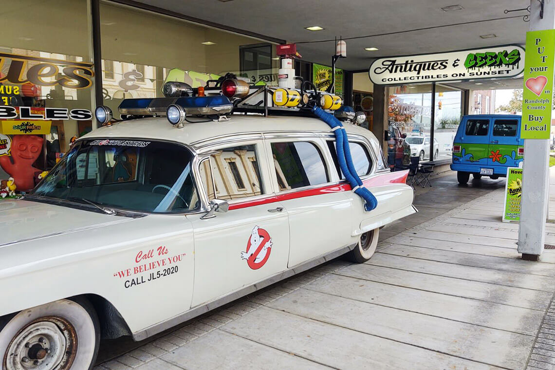 Ghostbusters car outside of Antiques & Geeks